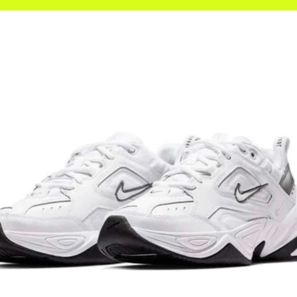 White Nike tennis shoes women’s size 9. Runs large